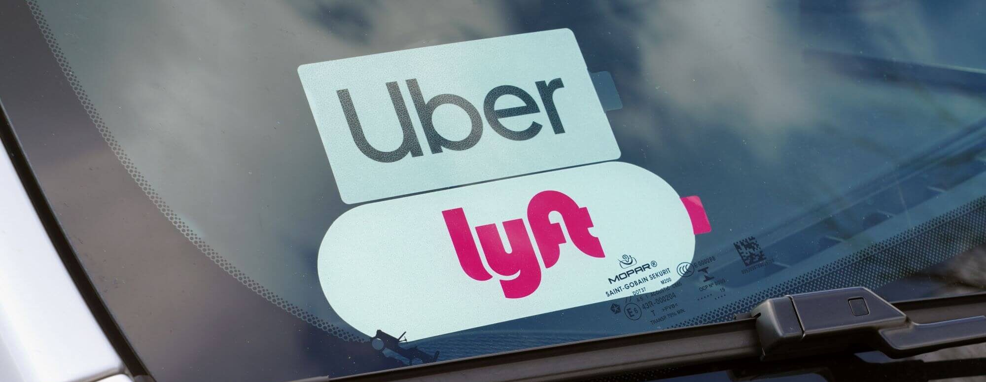 Uber and Lyft rideshare on window